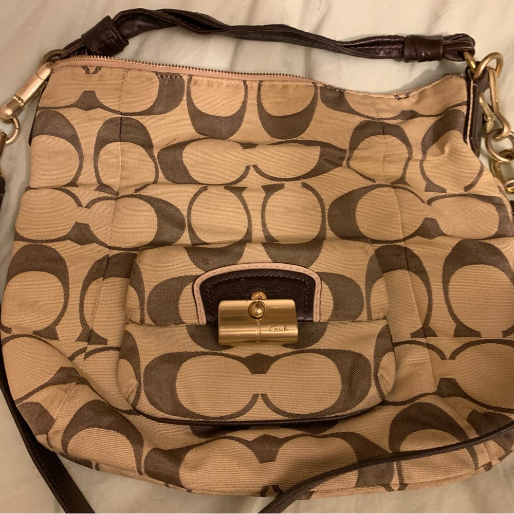 Authentic unique pre loved with care shoulder strap Coach purse with large logo.